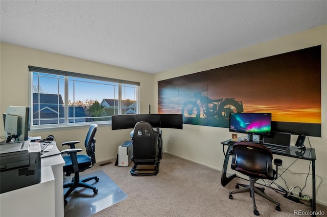 office area with visible vents, baseboards, carpet, and a textured ceiling