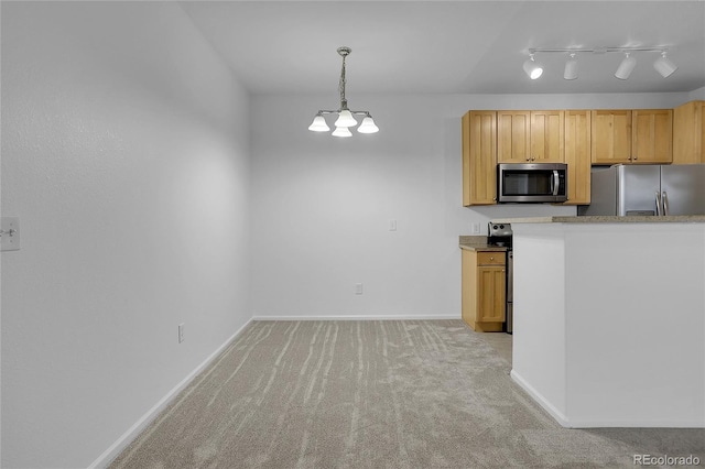 kitchen with pendant lighting, light brown cabinets, appliances with stainless steel finishes, light carpet, and a notable chandelier