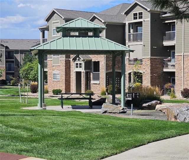 exterior space with a balcony and a front lawn