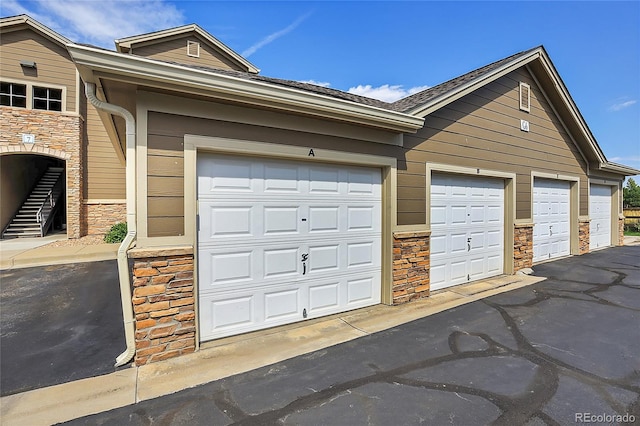 garage featuring wooden walls