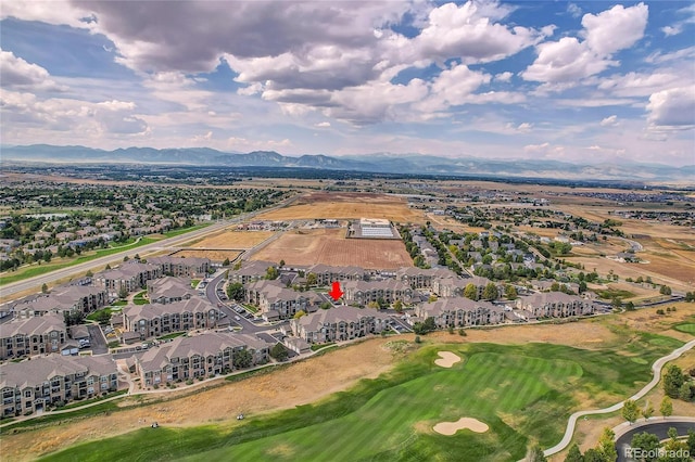 birds eye view of property with a mountain view