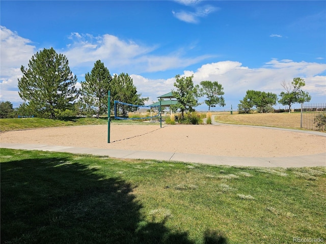 surrounding community with volleyball court and a yard