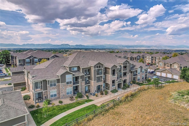 birds eye view of property featuring a mountain view