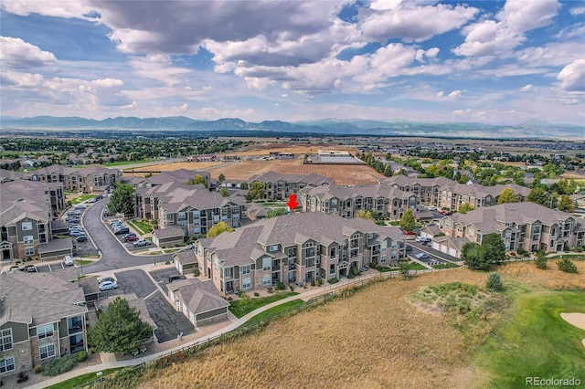 birds eye view of property with a mountain view