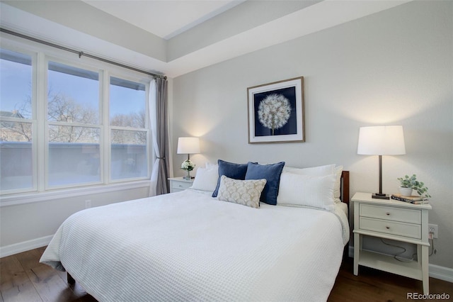 bedroom featuring dark wood-type flooring