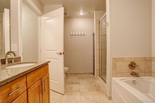 full bathroom featuring tile patterned floors, vanity, toilet, and separate shower and tub