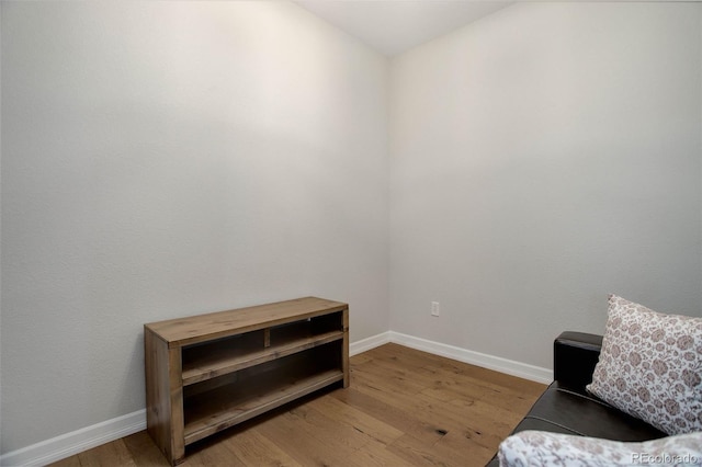 sitting room with hardwood / wood-style floors