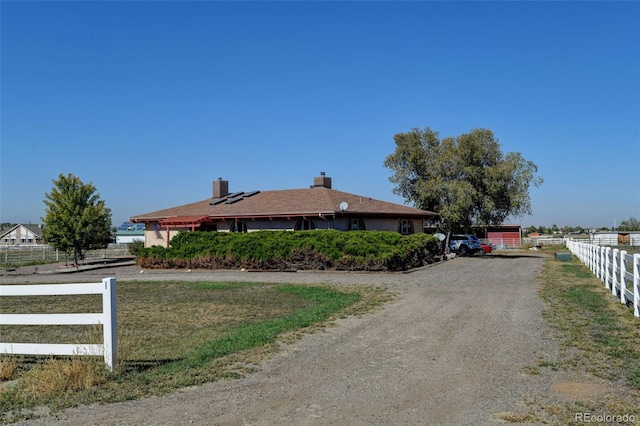 view of property exterior with solar panels