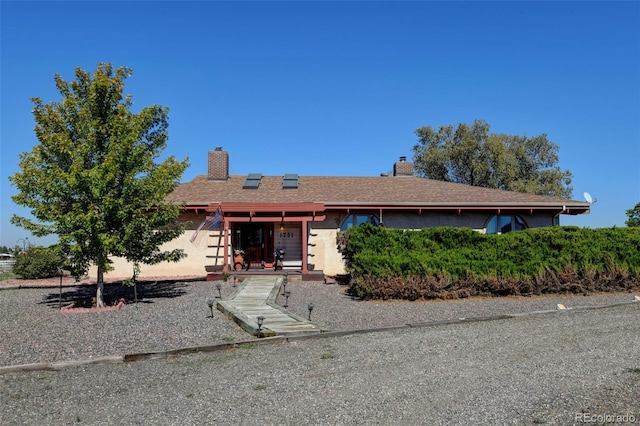 ranch-style home with solar panels