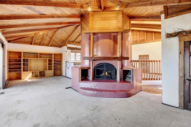 unfurnished living room featuring lofted ceiling with beams, light colored carpet, and wooden ceiling