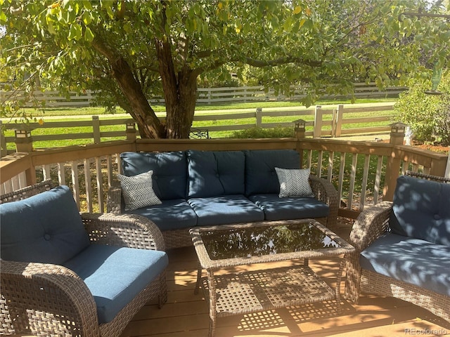 wooden deck featuring an outdoor hangout area, a yard, and fence