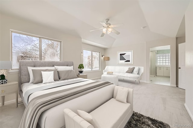 bedroom featuring multiple windows, baseboards, ensuite bathroom, and light colored carpet