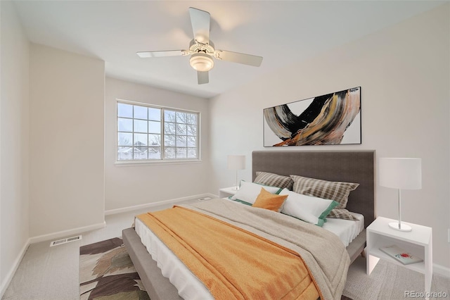 bedroom with ceiling fan, carpet, visible vents, and baseboards