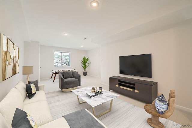 living room with baseboards and recessed lighting