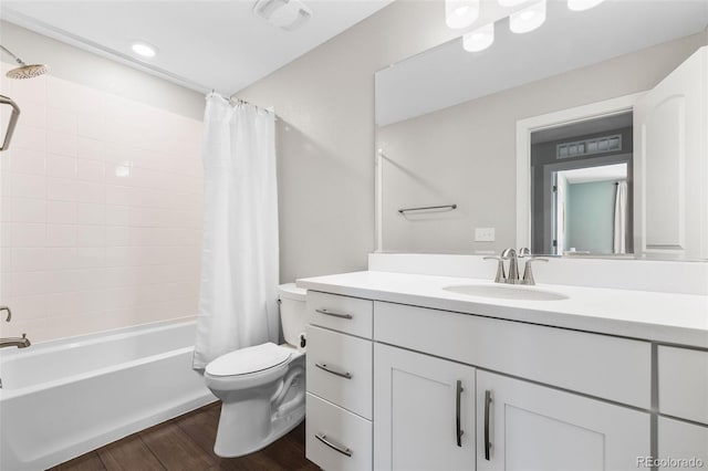 1632 Saddlesmith Pl, Castle Pines, CO 80108 - full bathroom with wood finished floors, toilet, vanity, and shower / bathtub combination with curtain