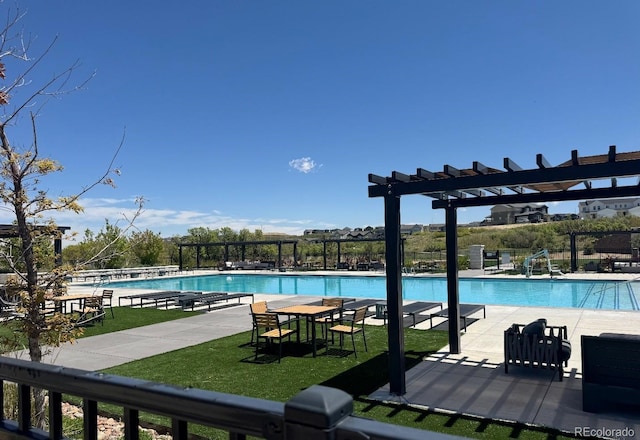 1632 Saddlesmith Pl, Castle Pines, CO 80108 - community pool featuring a pergola and a patio area