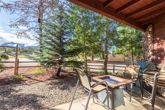 view of patio featuring an outdoor fire pit and area for grilling