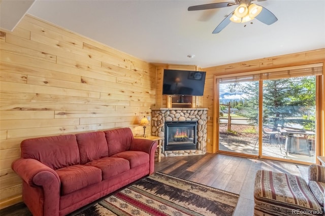 living area with wood walls and a healthy amount of sunlight