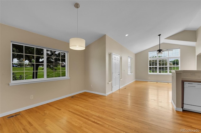 11268 Grove St Unit I, Westminster, CO 80031 - unfurnished living room featuring light wood-style floors, a ceiling fan, and vaulted ceiling