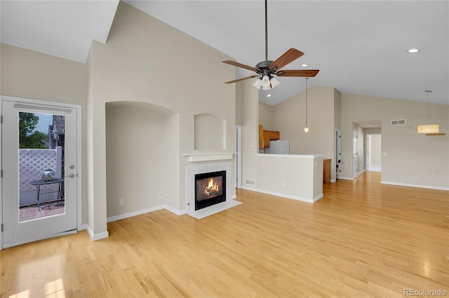 11268 Grove St Unit I, Westminster, CO 80031 - unfurnished living room with high vaulted ceiling, a ceiling fan, light wood-style floors, recessed lighting, and a fireplace