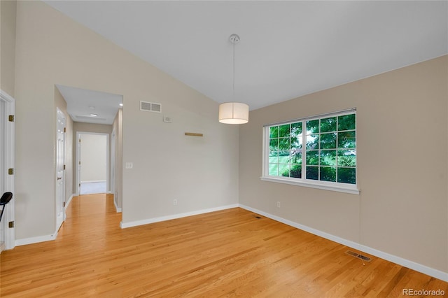 11268 Grove St Unit I, Westminster, CO 80031 - unfurnished room featuring light wood-style flooring and vaulted ceiling