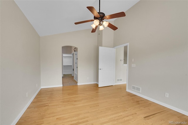 11268 Grove St Unit I, Westminster, CO 80031 - empty room with arched walkways, high vaulted ceiling, a ceiling fan, and light wood-style flooring