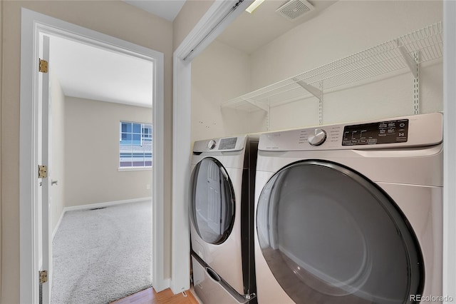 11268 Grove St Unit I, Westminster, CO 80031 - laundry area featuring independent washer and dryer and carpet