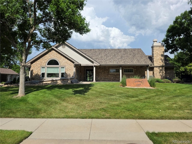 11268 Grove St Unit I, Westminster, CO 80031 - ranch-style home with a chimney, a front yard, and stone siding