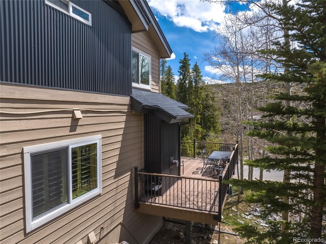 100 River Park Dr Unit A, Breckenridge, CO 80424 - view of side of property featuring a wooden deck, a shingled roof, and outdoor dining space