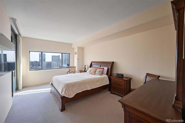 bedroom featuring light colored carpet