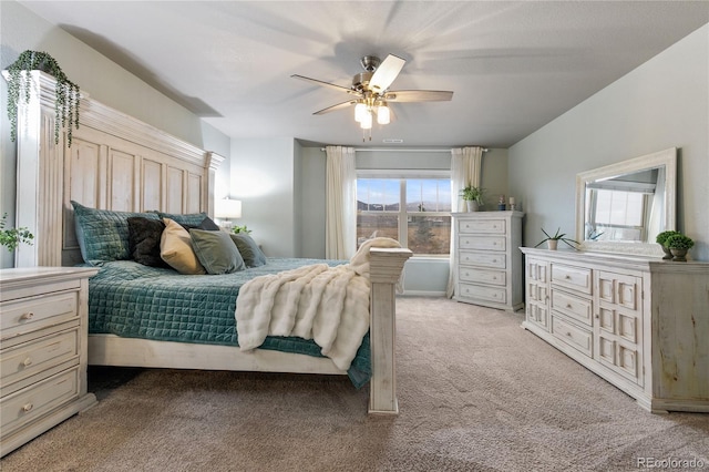 bedroom featuring light colored carpet and ceiling fan