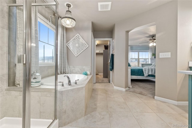 bathroom featuring tile patterned flooring, independent shower and bath, and ceiling fan