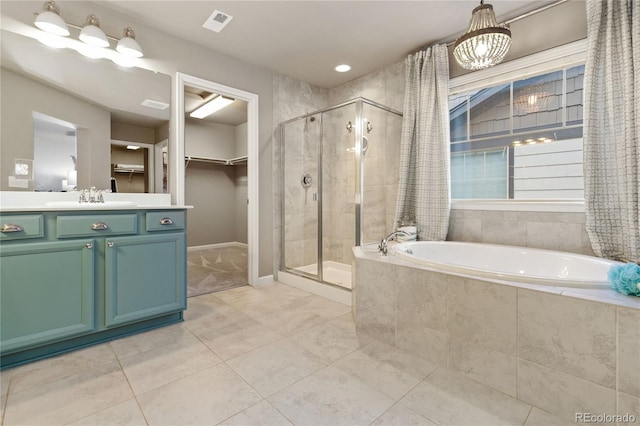 bathroom featuring vanity, separate shower and tub, and tile patterned flooring