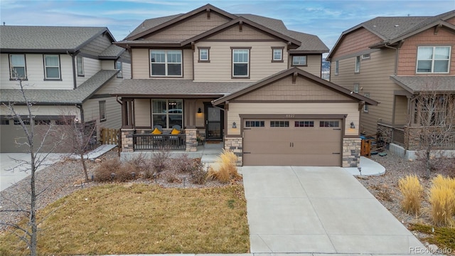 craftsman-style home with a front lawn and covered porch