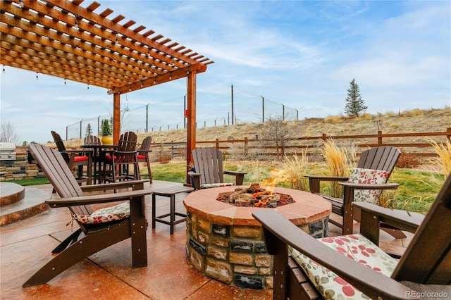 view of patio / terrace featuring a pergola and a fire pit