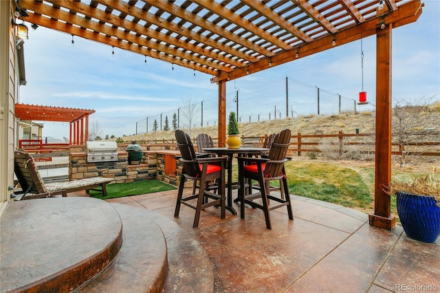 view of patio with outdoor dining space, fence, area for grilling, and a pergola