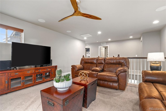 living room featuring a ceiling fan, recessed lighting, light carpet, and visible vents