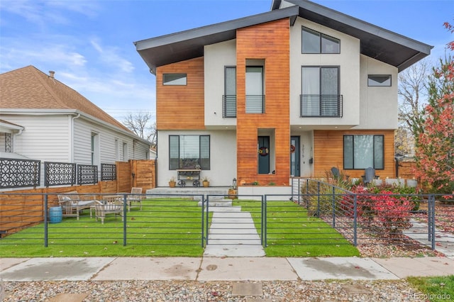 modern home with a front yard