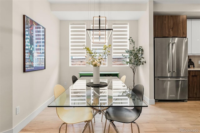 dining room with light wood-type flooring