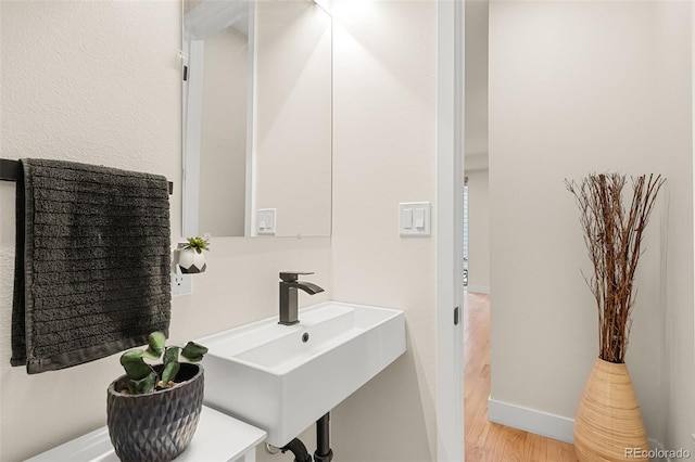 bathroom featuring sink and hardwood / wood-style floors