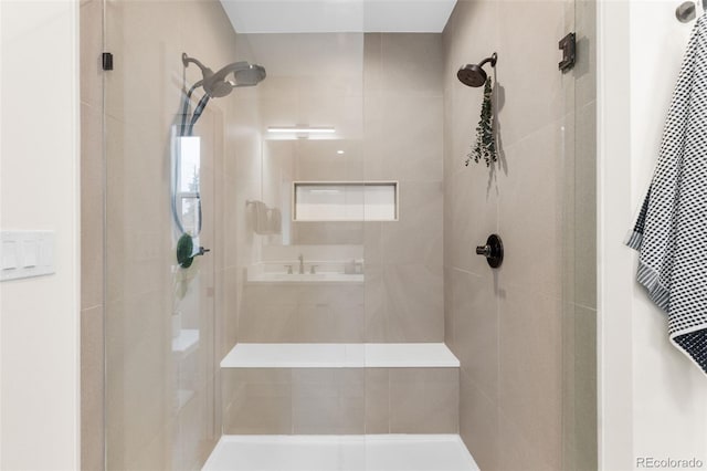 bathroom with tiled shower