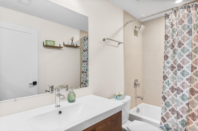 full bathroom featuring toilet, vanity, and shower / bath combination with curtain