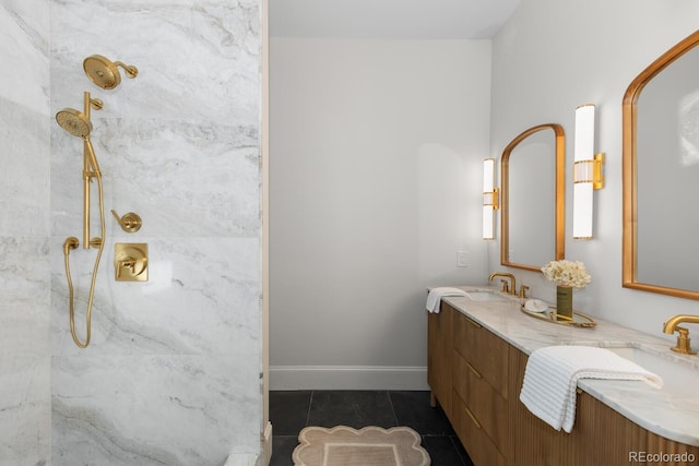 bathroom featuring tile patterned floors, a sink, a marble finish shower, and double vanity