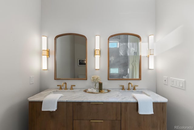 full bath featuring double vanity and a sink