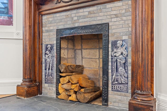 details featuring a brick fireplace