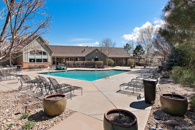 community pool featuring a patio area