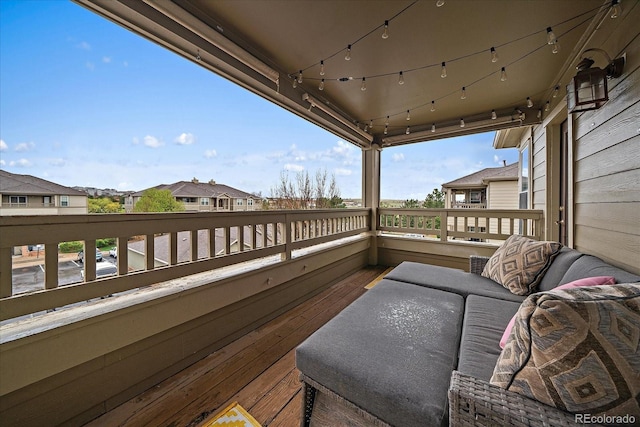 wooden terrace featuring a residential view