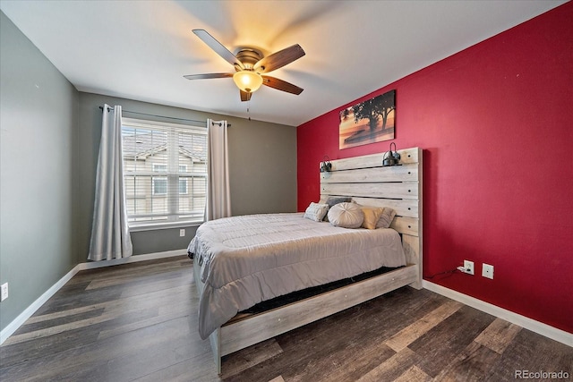bedroom featuring wood finished floors, baseboards, and ceiling fan