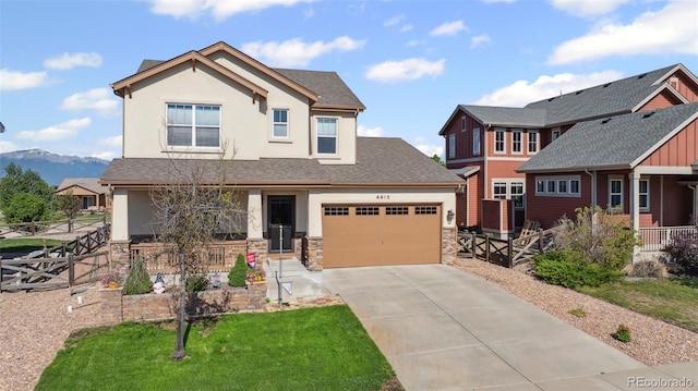 6612 Big Leaf Ln, Colorado Springs, CO 80927 - craftsman-style home featuring stucco siding, stone siding, driveway, and a porch
