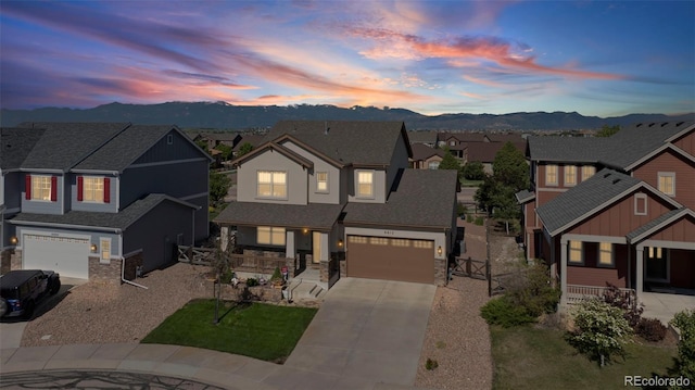 6612 Big Leaf Ln, Colorado Springs, CO 80927 - view of front of home with driveway, a porch, a mountain view, and a residential view